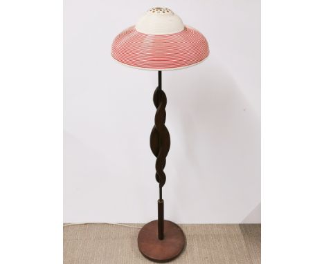 A 1970's teak and brass lamp, H. 124cm. Together with a 1950's plastic ceiling shade.