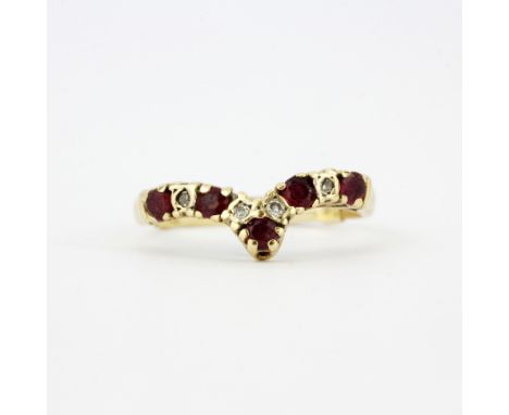 A hallmarked 9ct yellow gold ruby and diamond wishbone ring, (K.5). With 9ct gold ring adjuster attached. Approx. 1.6g.