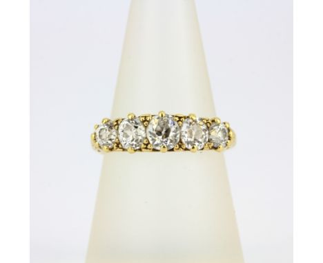 A yellow metal (tested 18ct gold) ring set with large old brilliant cut diamonds, estimated approx. 1.30ct total, (P).