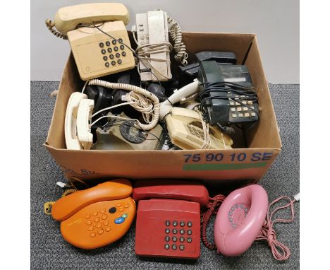A quantity of vintage telephones.