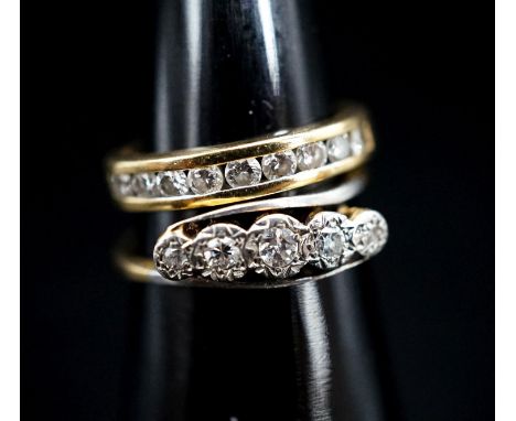 A 750 yellow metal and channel set nine stone diamond ring, size G, gross 2.6 grams and an early 20th century yellow metal an