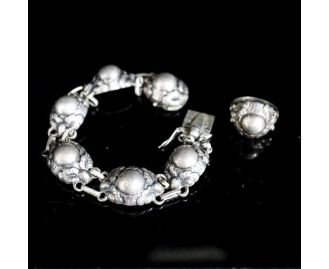 A Georg Jensen sterling bracelet, no. 57A, 18.5cm and a similar ring, no. 11A.