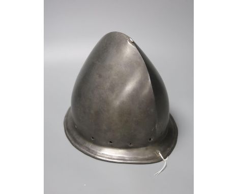 A good Italian Infantry Helmet Cabasset c.1580, polished steel raised from a single plate, medial ridge with pear stalk finia