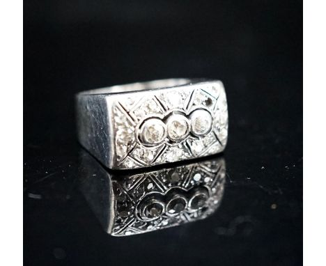 A 585 white metal and diamond cluster set tablet ring (stone missing), size N/O, gross 8.1 grams.