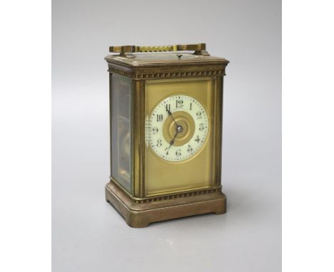 A French brass carriage clock with repeat, 18.5 cm high with the handle up