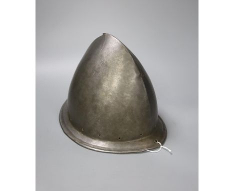 A good Italian Infantry Helmet Cabasset c.1580, polished steel raised from a single plate, medial ridge with pear stalk finia