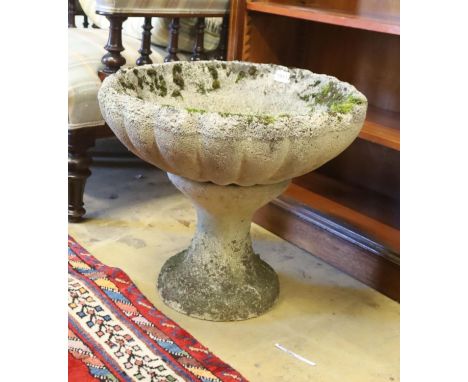 A circular reconstituted stone garden planter on stand, diameter 49cm, height 42cm