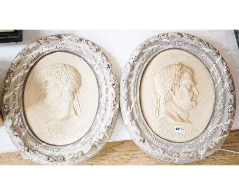 A decorative pair of faux marble portrait reliefs of Roman emperors 38cms