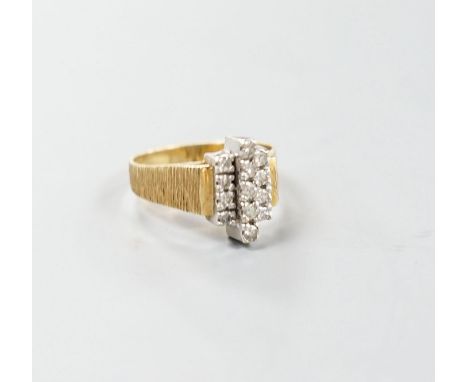 A 1970's textured 18ct gold and thirteen stone diamond set geometric dress ring, size Q, gross weight 5.3 grams.