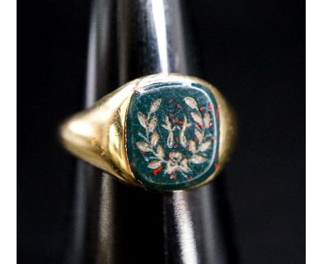 A mid 20th century 18ct gold and carved bloodstone set signet ring, size N, gross 8.3 grams.