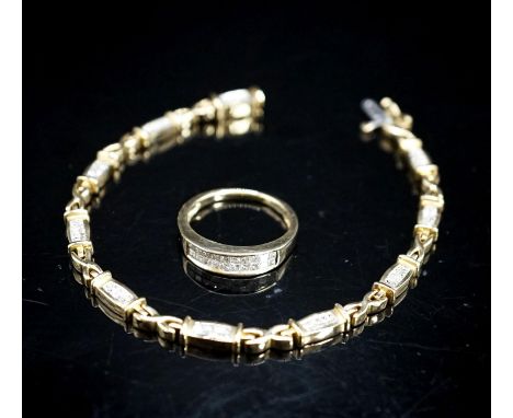 A modern 14k yellow metal and diamond chip set line bracelet, 18cm and a matching ring, size O/P, gross weight 17.2 grams.