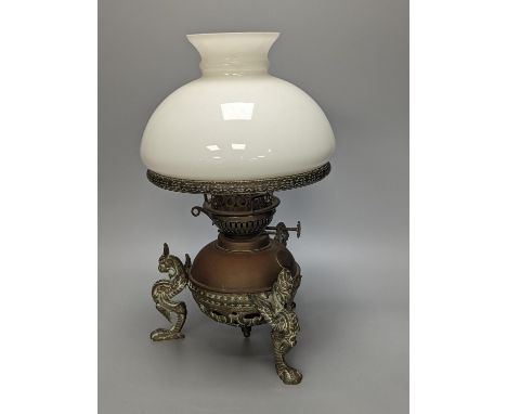 A brass and copper animal monopodia oil lamp, height 36cm