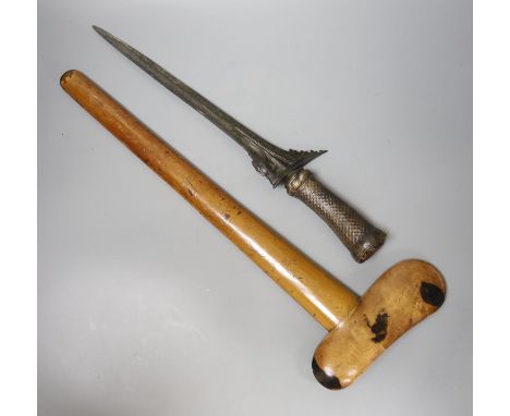 An Indonesian dagger kris, 19th century, earlier black and silver-coloured watered blade, brass hilt, wooden scabbard, blade 