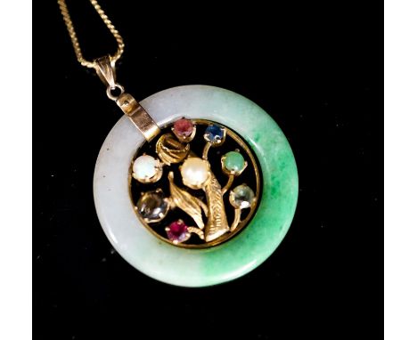 A yellow metal and gem set mounted jade disc pendant, 30mm on s yellow metal fine link chain, gross weight 9.2 grams.