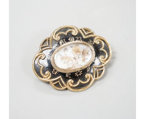 A Victorian yellow metal and black enamel cartouche shaped mourning brooch, with engraved inscription dated 1852, 57mm, gross