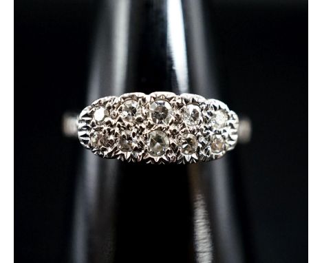 An 18ct &amp; plat and two row diamond set cluster ring, size O, gross weight 2.7 grams.