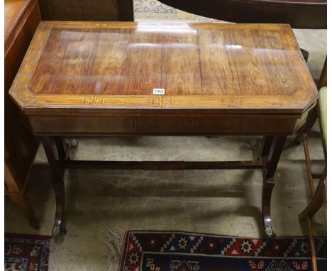A Regency Kingwood folding card table, banded and brass line inlaid, width 89cm, depth 44cm, height 71cm