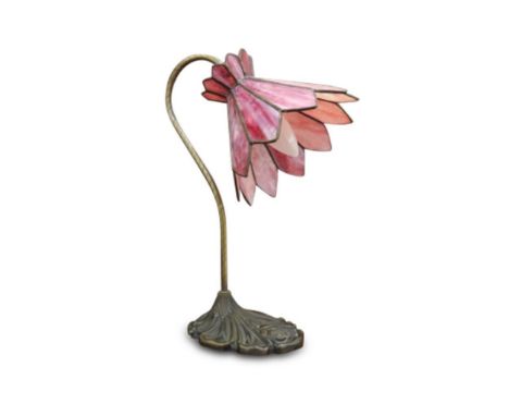 the Irish stained glass shade supported by a brass lamp holder on a bronzed foliate base, maker Adrian Gray, Dublin