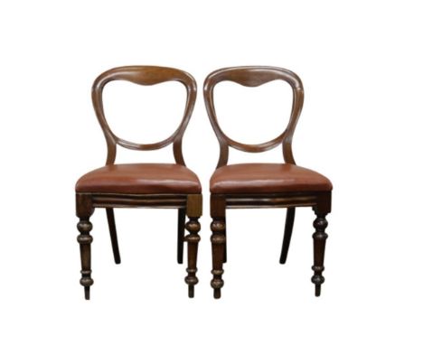 The shaped bath's, above bow fronted seats, raised on turned tapering support
