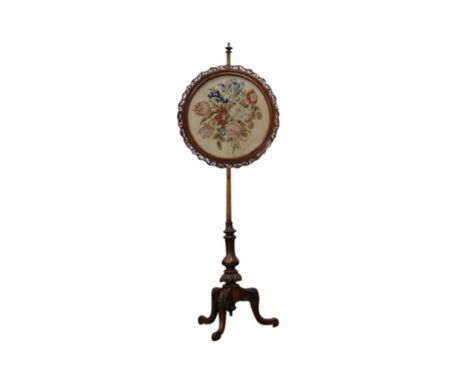The tapestry screen, held within a pierced work circular frame, on a single turned support, terminating in a tripod base, 50 