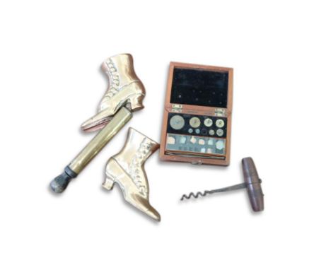 together with corkscrew, pair brass boot ornaments and another brass item