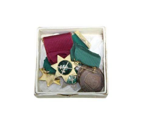 struck in silver gilt and green enamel, together with two others and three Masonic copper coins