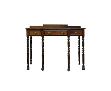 the small stepped back resting on a breakfront top with reeded edge above three frieze drawers with brass ring handles, all r