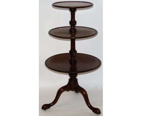 A Georgian mahogany three tier dumb waiterOf typical form with turned supports and tripod base, height 108cm, diameter of lar