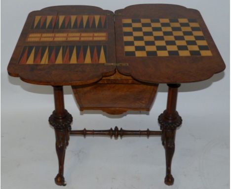 A Victorian burr walnut veneered games tableWith revolving hinged top, set out for chess, backgammon and cribbage, over a bas