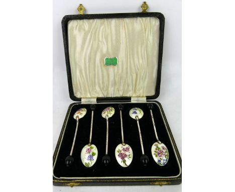A set of six George VI silver and enamel backed bead end coffee spoonsDecorated with floral designs, hallmarked Birmingham 19