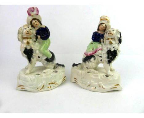 A pair of 19th Century Staffordshire Spaniels with children'The Princess Royals with Dash' double quill holders, Circa 1850, 