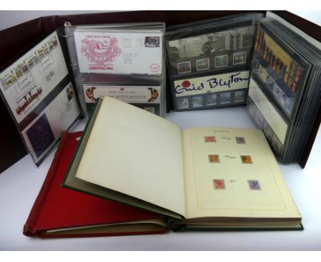 Two stamp albums containing mint and used stamps of the worldAnd two Royal Mail albums containing in excess of fifty presenta