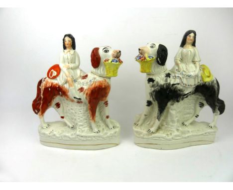 A pair of 19th Century Staffordshire Flower Basket SpanielsEach with separate back legs, height 26cm   CONDITION REPORT:  Bro