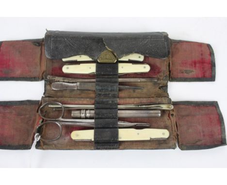 A 19th Century travelling surgeons medical setIn leather case, comprising various ivory mounted folding tools, artery clips, 