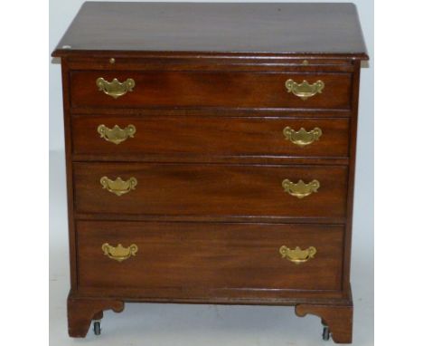 A 19th Century and later small mahogany chest of drawersWith brushing slide over four full length drawers with brass handles,