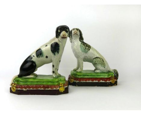 A pair of fine quality Staffordshire Enoch Wood Pearlware dogsEach having coloured bodies and cushion bases, circa 1800, heig