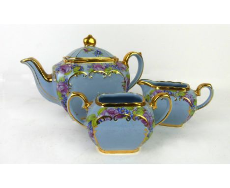 A Sadler three piece Cube tea serviceHaving floral decoration to body, pattern number 2031   CONDITION REPORT:  Sugar basin w