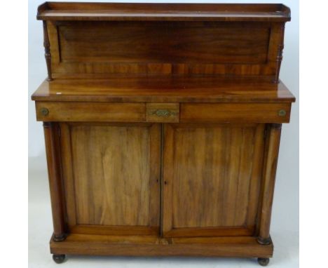 An early Victorian rosewood chiffonier The single shelf back raised on turned supports, over a base with two short drawers an