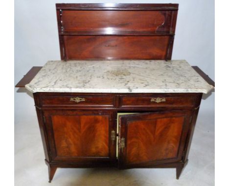 A late 19th Century mahogany marble top side cabinet, in the French Empire styleThe back with pull up shelf section over a ba