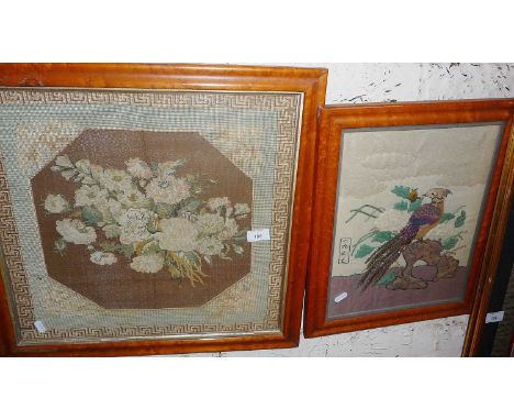 Tapestry picture of flowers and a needlework applique picture of a bird, both in maple frames