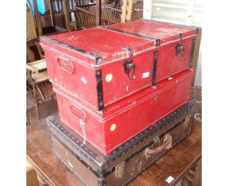 Two old metal deed boxes (one with military arrow mark), and a vintage trunk with shipping labels