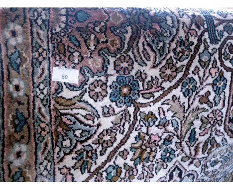 Iranian floor rug, 200cm x 146cm, on cream ground, silky finish