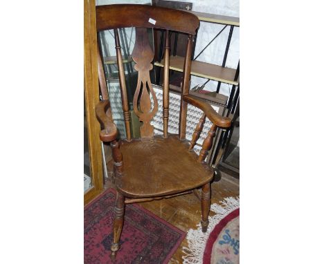 Victorian ash and elm kitchen armchair having shaped back splat and turned supports