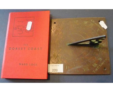 Small bronze sundial inscribed Thos Smith, Aylesbury 1764, 6" x 6" base and a Ward Lock book of the Dorset Coast 