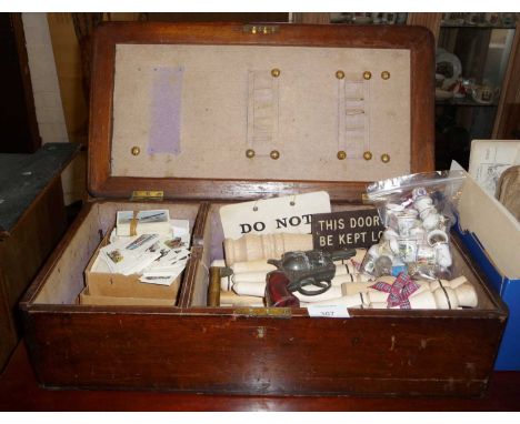 Old mahogany box and contents, inc. cigarette cards, turned wood porridge stirrers, china thimbles, etc.