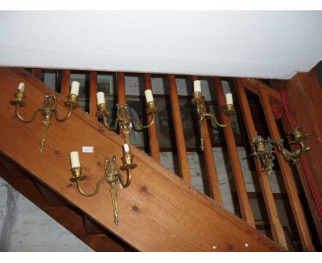Set of four twin branch brass Regency-style wall lights and a French ormolu wall double candlestick