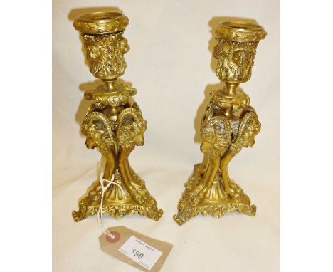 19th c. gilt bronze pair of Louis XVI candlesticks decorated with lion masks, and heads and legs of rams, approx. 20cm high