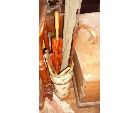 Painted wood stick stand and contents, inc. walking sticks, Chinese parasol and a fishing rod