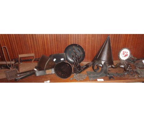 Assorted metalware including funnels, hooks, trivets and flat irons, etc