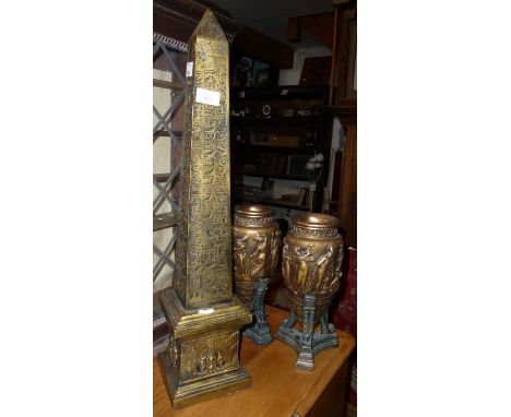 Resin obelisk decorated with Egyptian hieroglyphics, approx. 67cm high and a pair of classical style urns